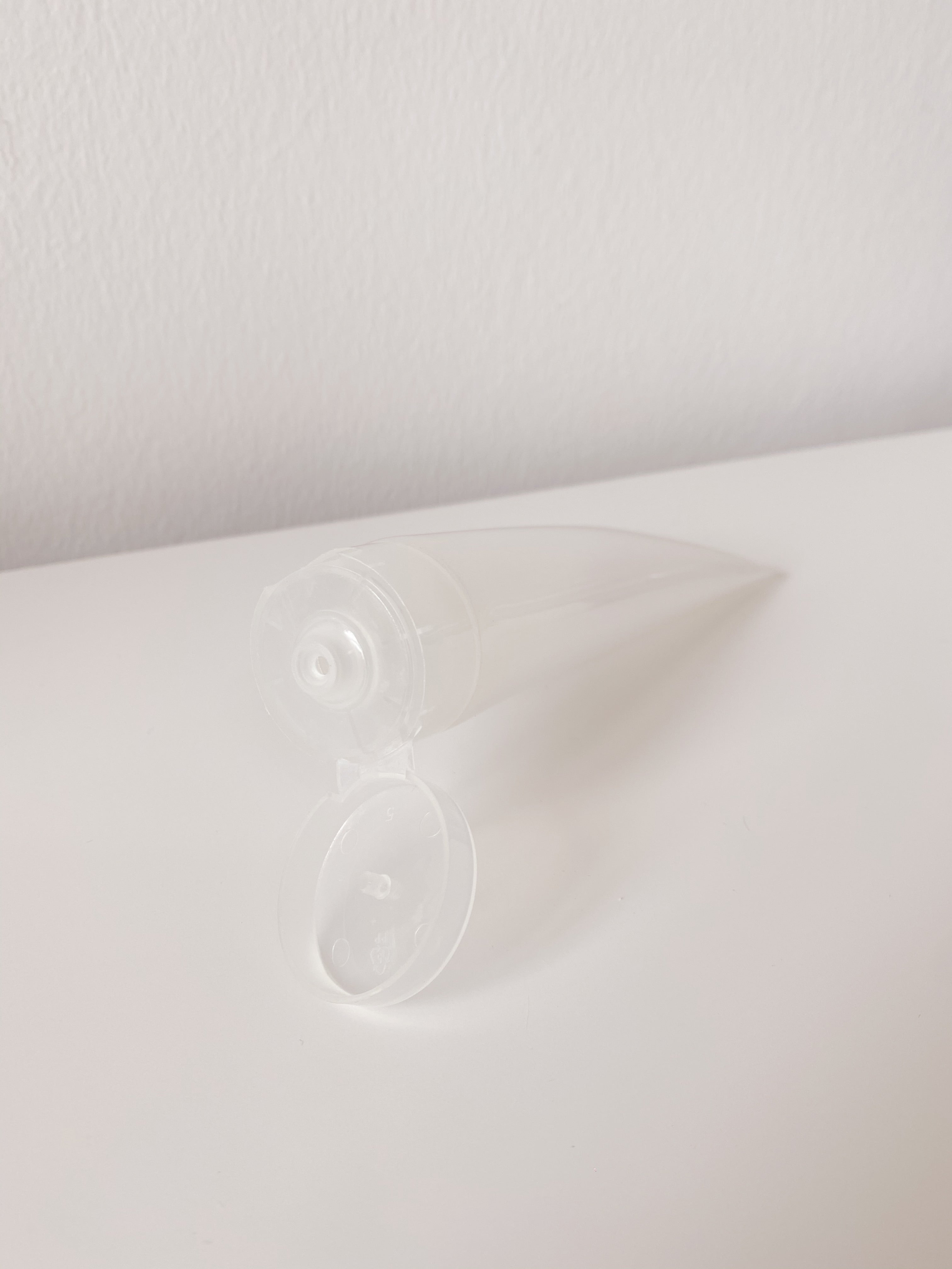 refillable frosted squeezy tube - WANT Skincare